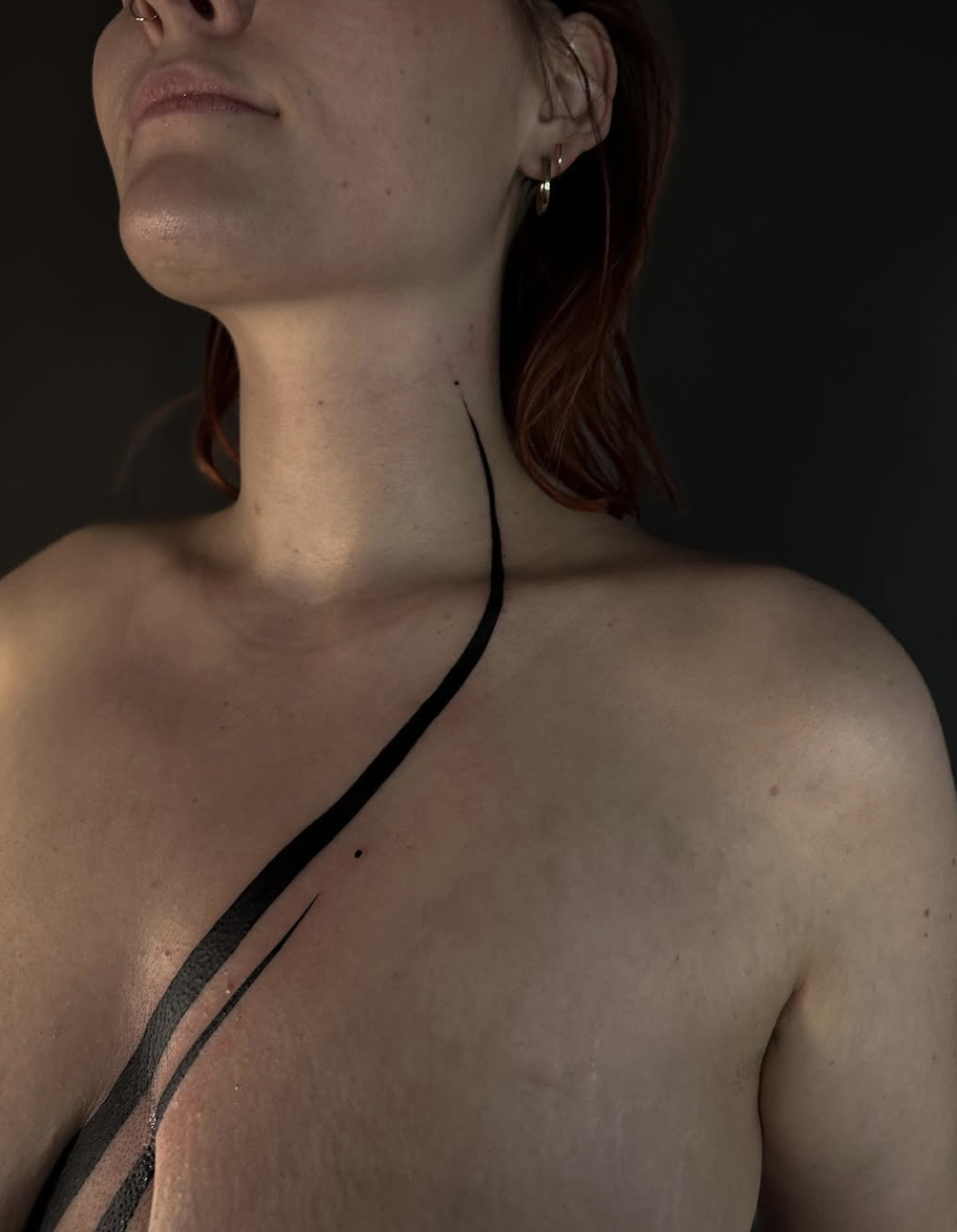 Minimalism — reduced abstract tattoo in fine line