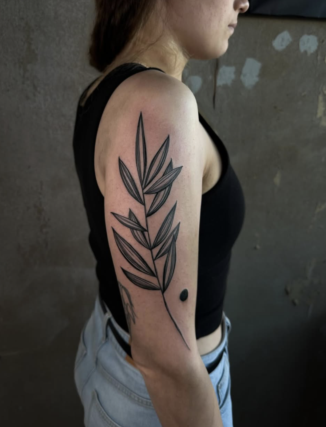 Simplicity — minimal single-line tattoo